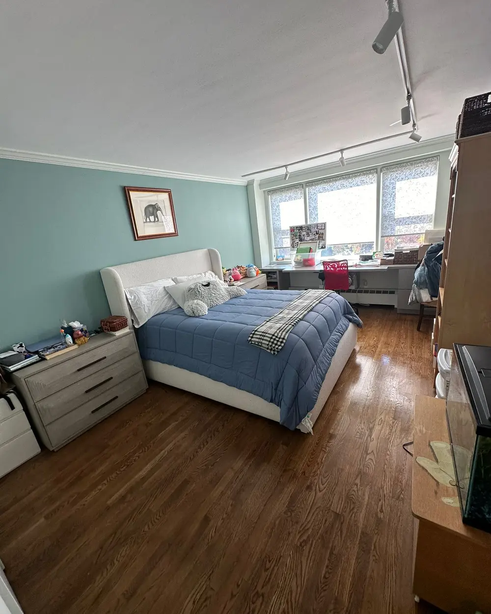 Neatly made bedroom after residential cleaning